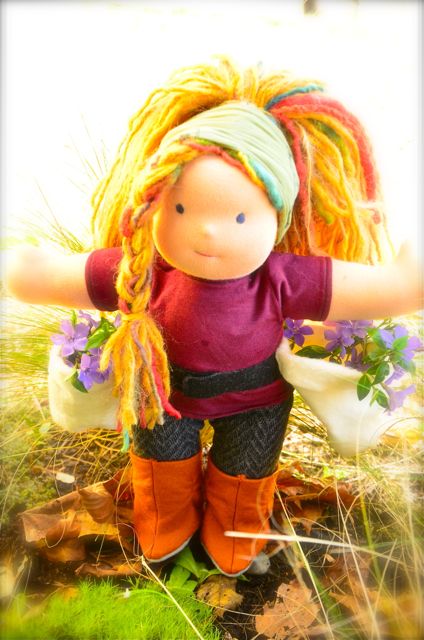 Charlie is sporting her treeplanting outfit equipped with dolly sized planting bags, though she prefers planting flowers!